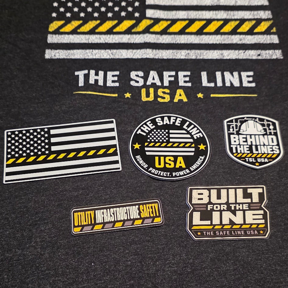 The Safe Line USA decal pack displayed with the Safety Flag Tee