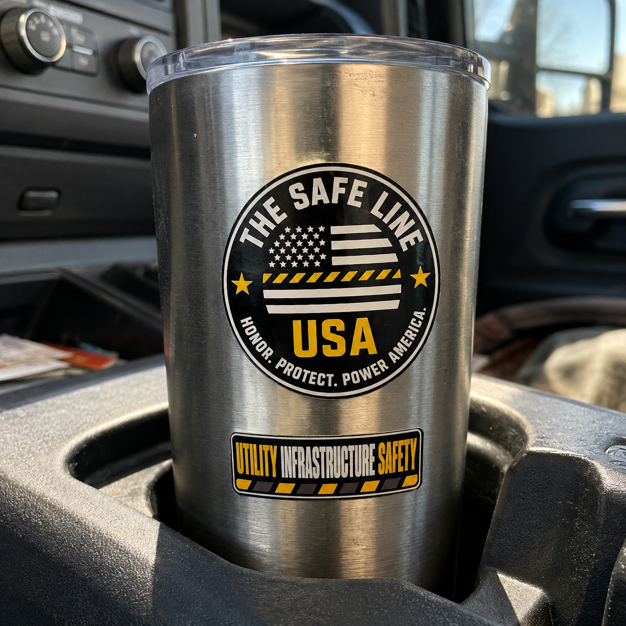 The Safe Line USA round emblem and Utility Infrastructure Safety decals applied to a metal work tumbler